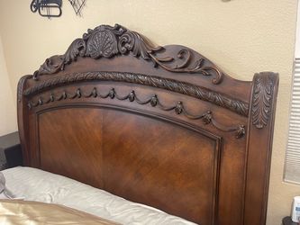 Ashley bed frame queen with small dresser and bedspread