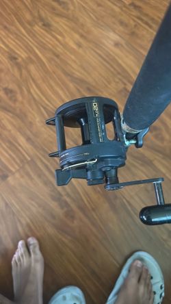 Angler center vintage rod and TLD 20 reel