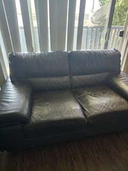 Slightly used brown leather furniture