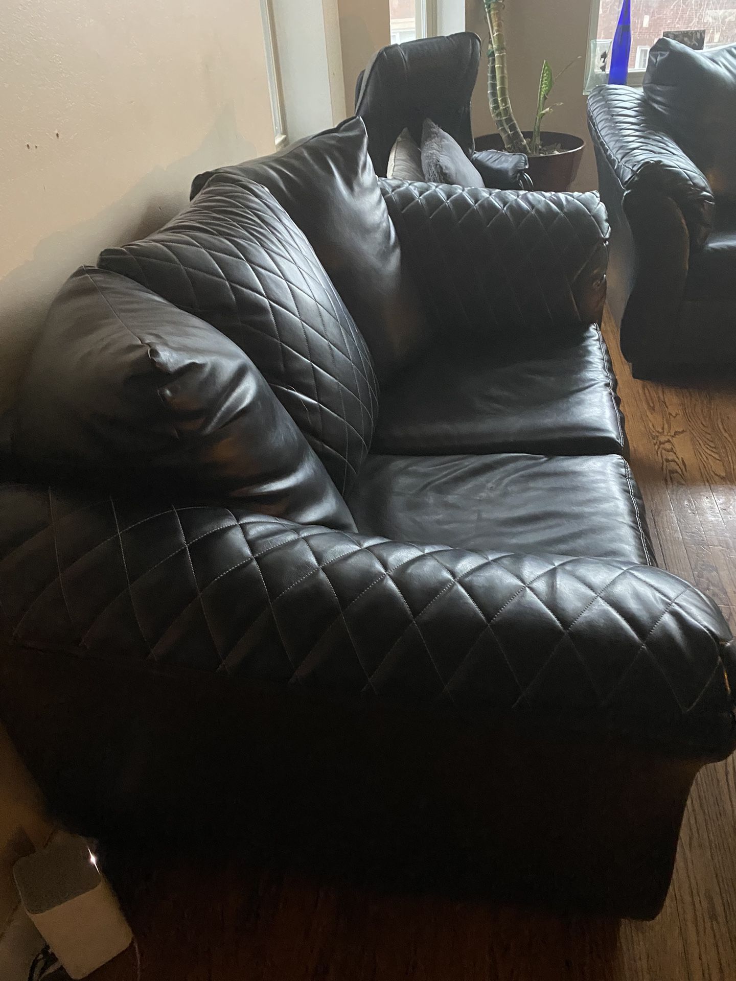 BLACK COUCH , LEATHER, Bed included Inside 