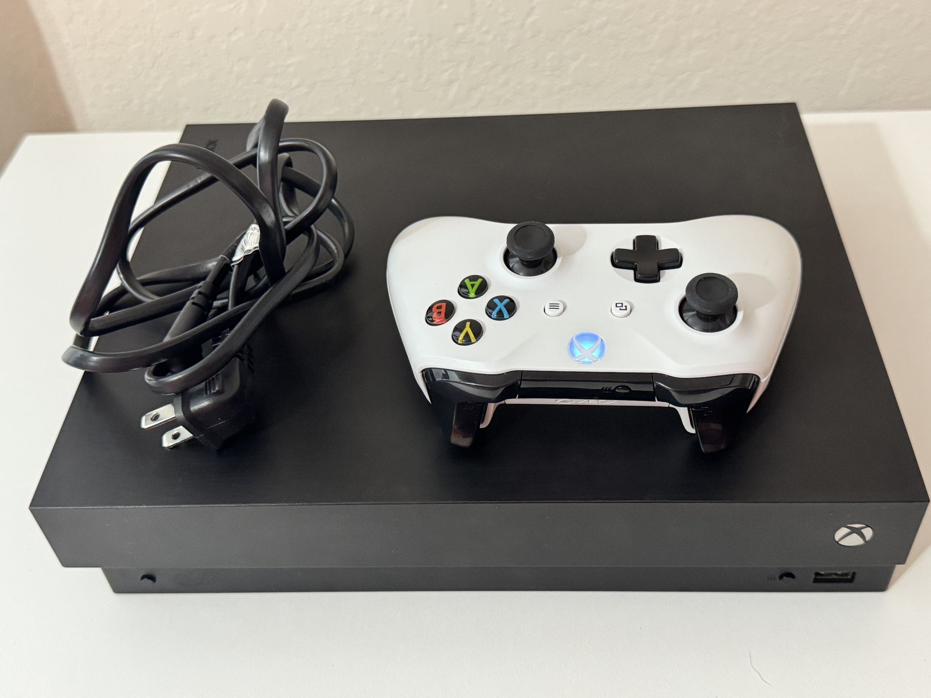 Xbox One X includes 1 Controller HDMI Cable And Power Cord (0 Games Included)
