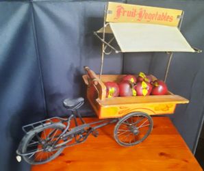 fruit and vegetable cart metal sculpture,