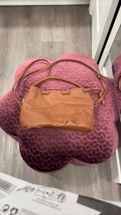 Nice tan universal Thread crossbody, with braided handle. See pictures.