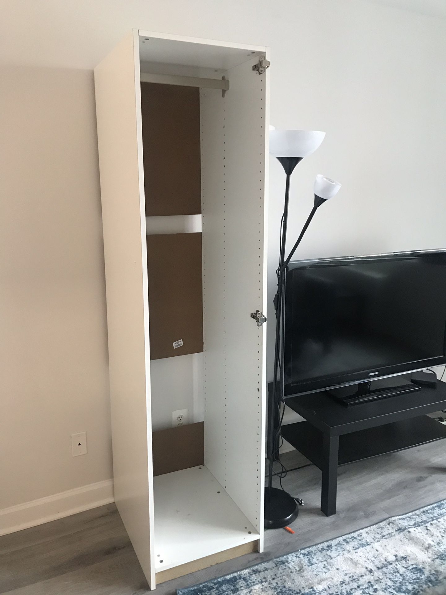 IKEA PAX closet with clothes rod and door hinges