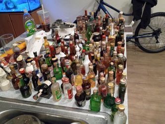 Collectable miniature bottles some full some half full