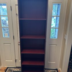 Mahogany finish Dania Bookcase, Bookshelf. 80 inches high by 24 inches wide by 12 inches deep. Shelving is adjustable. Excellent condition.