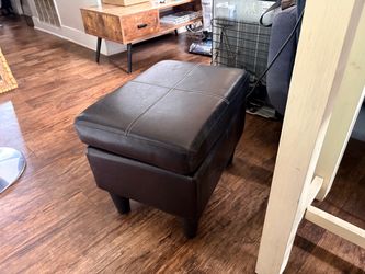 Black faux leather ottoman