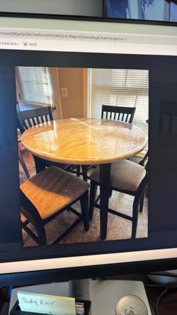 Round marble table with four chairs