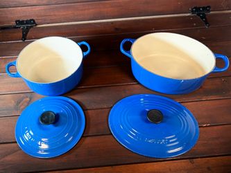Tow Le Creuset Dutch ovens