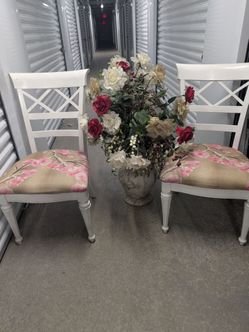 Two chairs large floral vase