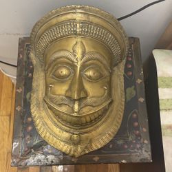 Antique mask made out of brass very heavy