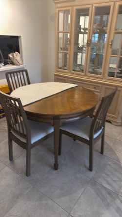 $ 75 Dining room table with leafs and pad and 3 chairs