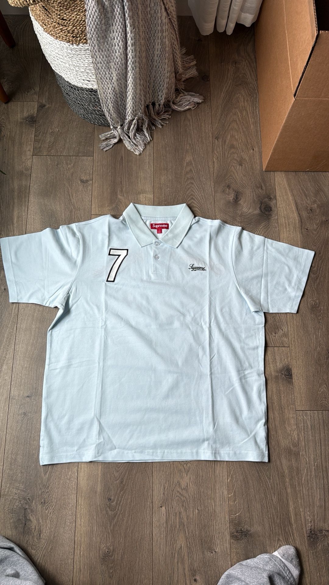 Supreme ‘World Famous’ 7 Polo by Supreme