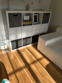 Ikea shelving unit with drawers and cabinets
