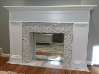 Custom built marble and stone decorative fire place.