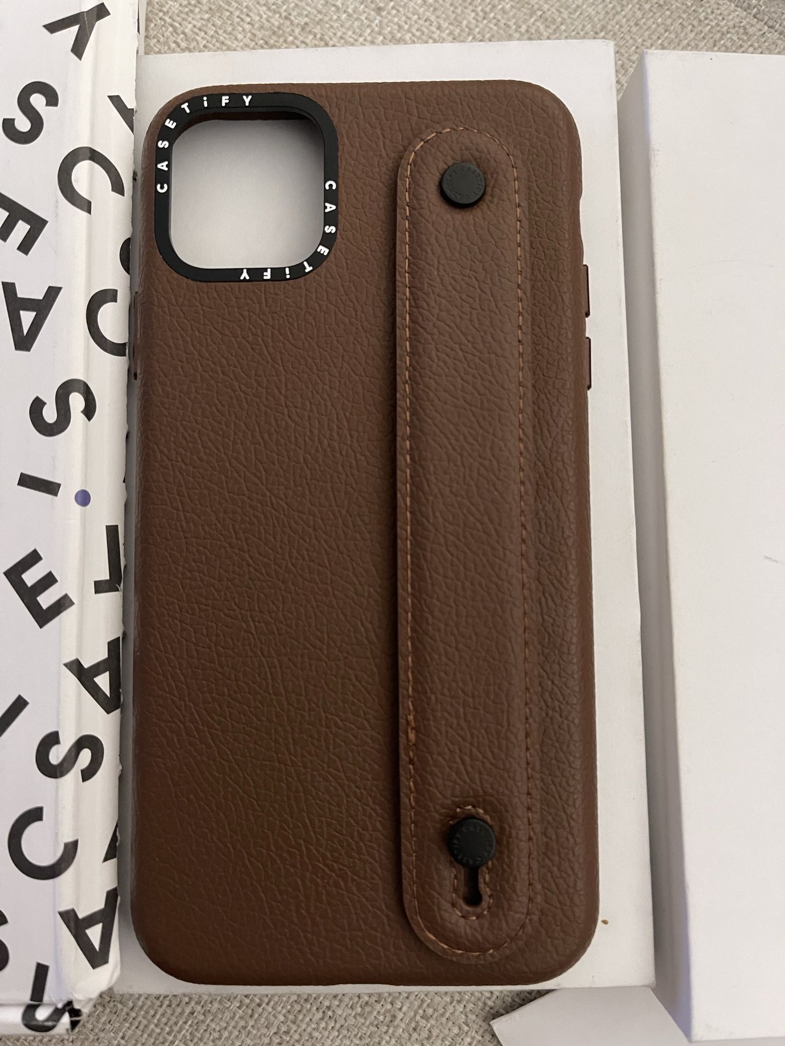 Casetify IPhone 12 Pro Max Leather case with strap to hold comfortably and acts as a phone stand. You can customize with charms (not included)  - used