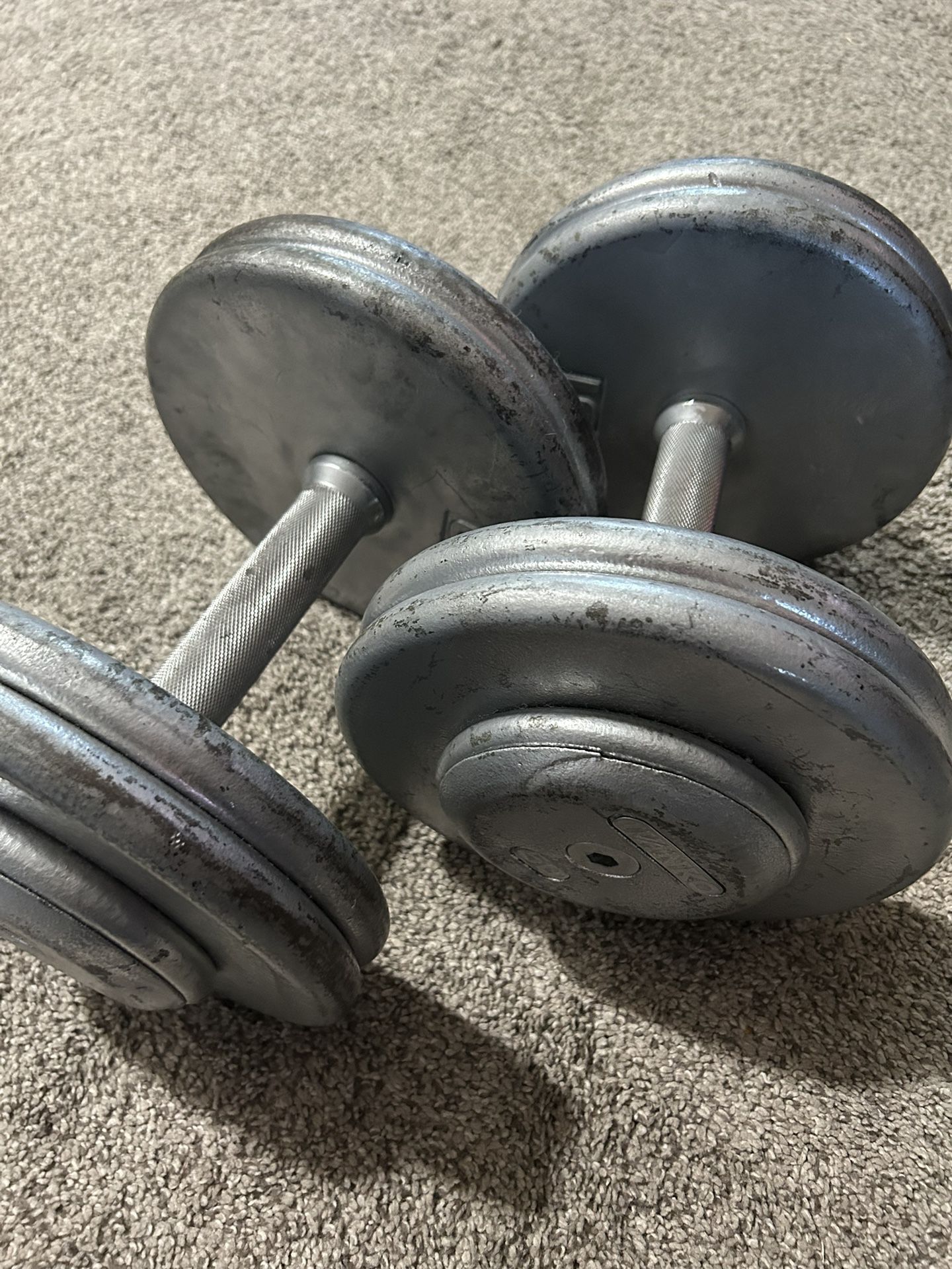 Pair Of 50 Pound Dumbbell Round