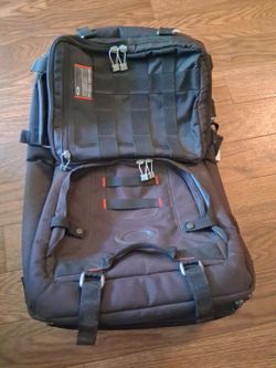 OAKLEY TACTICAL FIELD GEAR. ROLLING HEAVY  CANVAS CARRY ON.