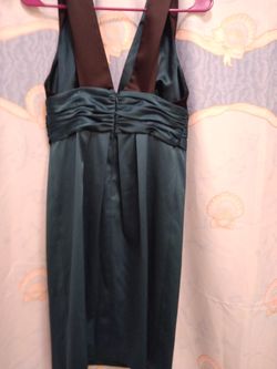 Brand New with tag dk green & black dress size 6.  $20.00 OBO