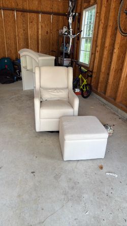 Beige swivel chair with ottoman