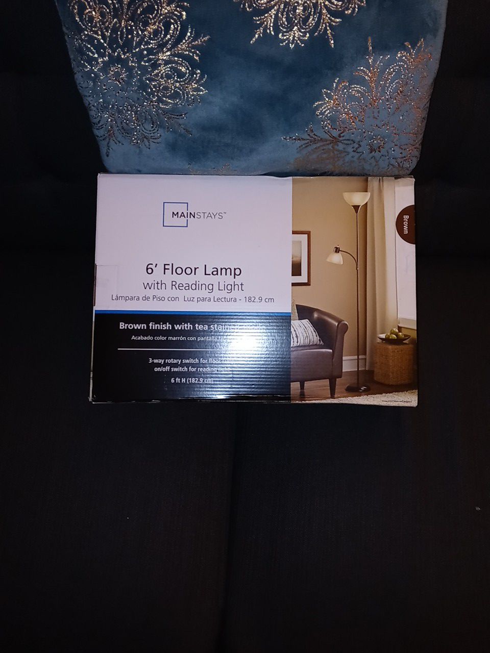 Floor lamp with an attached reading light
