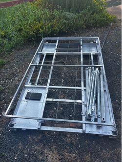 4x7 metal shipping pallet with side struts and grid top