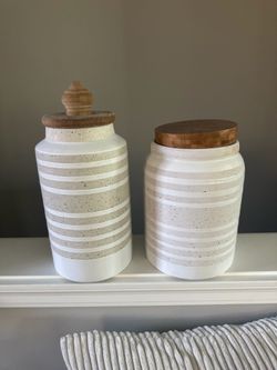 Set of 2 Striped Decorative Ceramic Jars/Canisters with Wood Lids. One is 9” and one 10” tall.