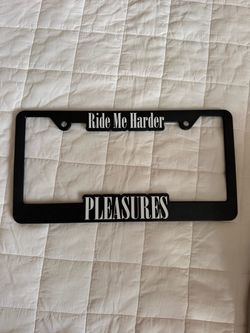 Pleasures license plate frame