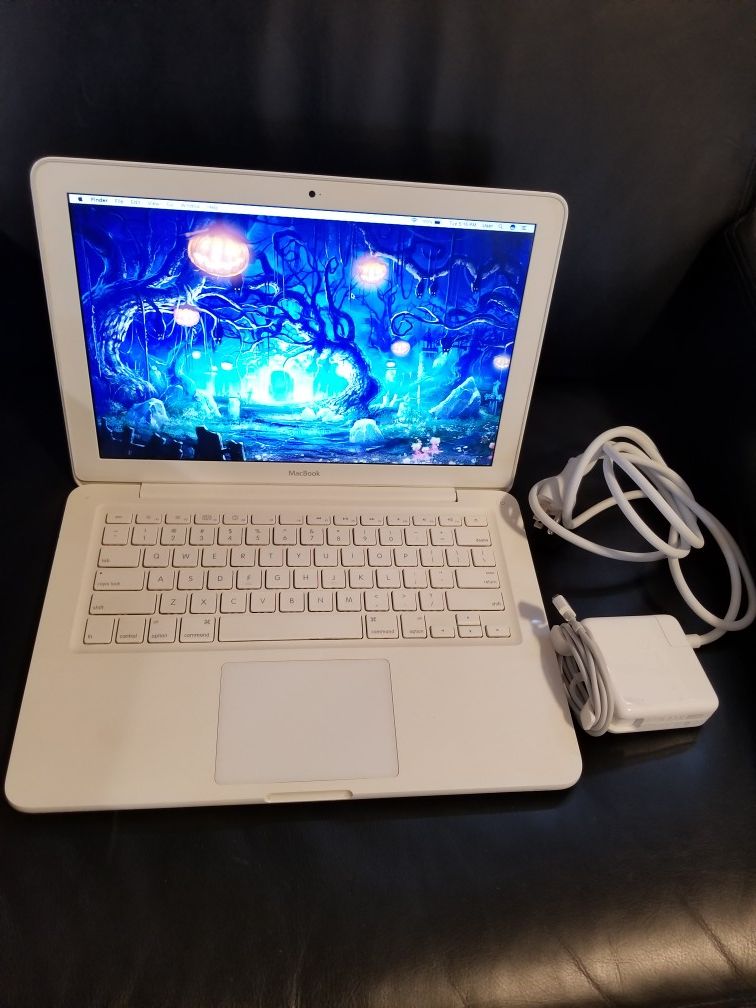 MACBOOK WITH MEMORY UPGRADE Software included free Adobe Photoshop 4GB RAM Logic Pro Light room Premiere Pro Facetime Animation Graphic design
