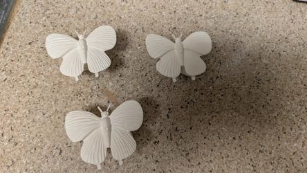 Set of 3 butterfly wall hooks. Dimensions: 3” wide, 2.5” tall, 1” deep. 