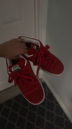 Red puffy puma shoes