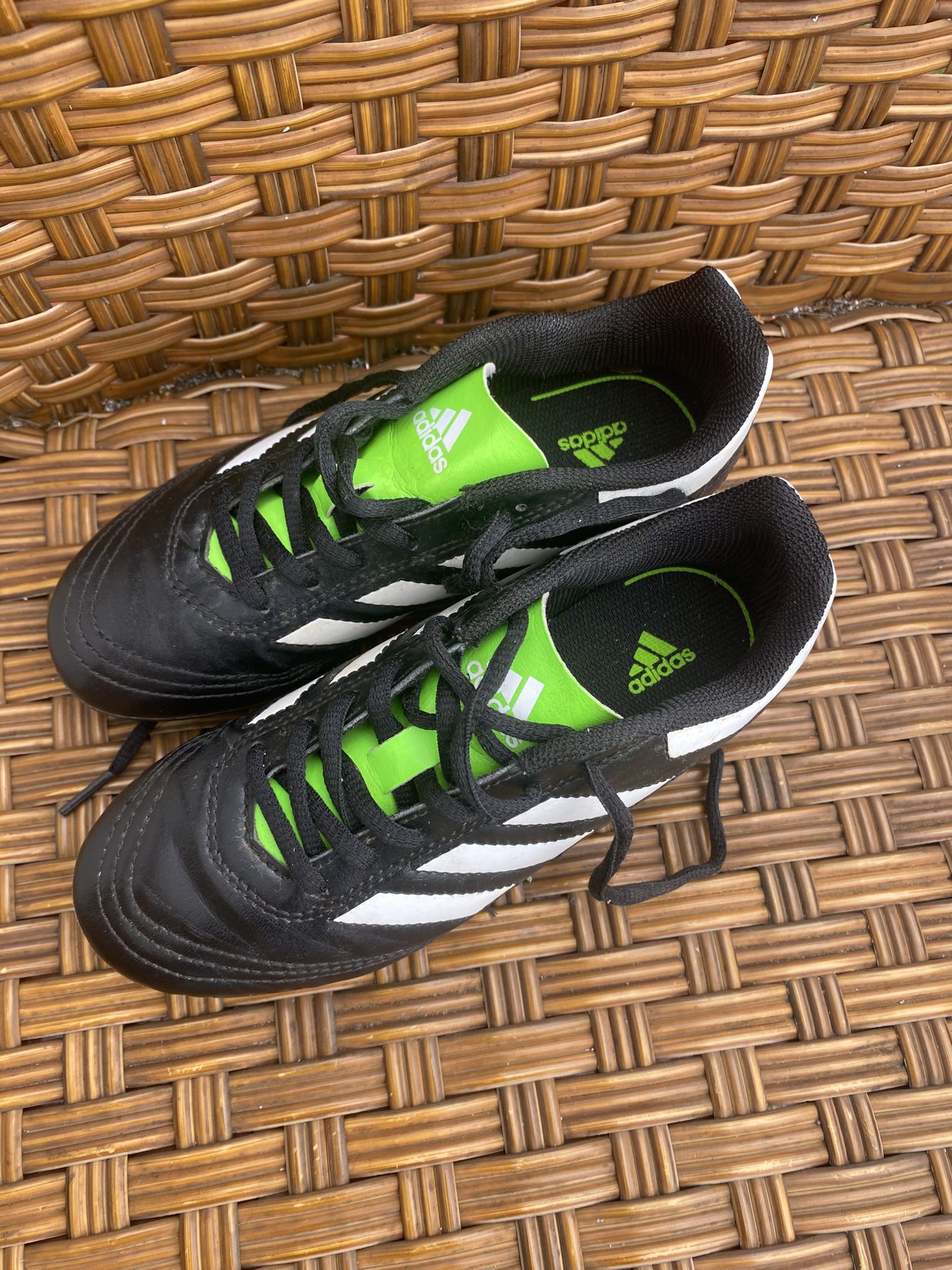 Excellent condition Adidas Kids cleats size 1.5 black, white & bright green