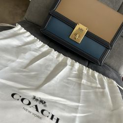 Coach purse  in blue in beige 