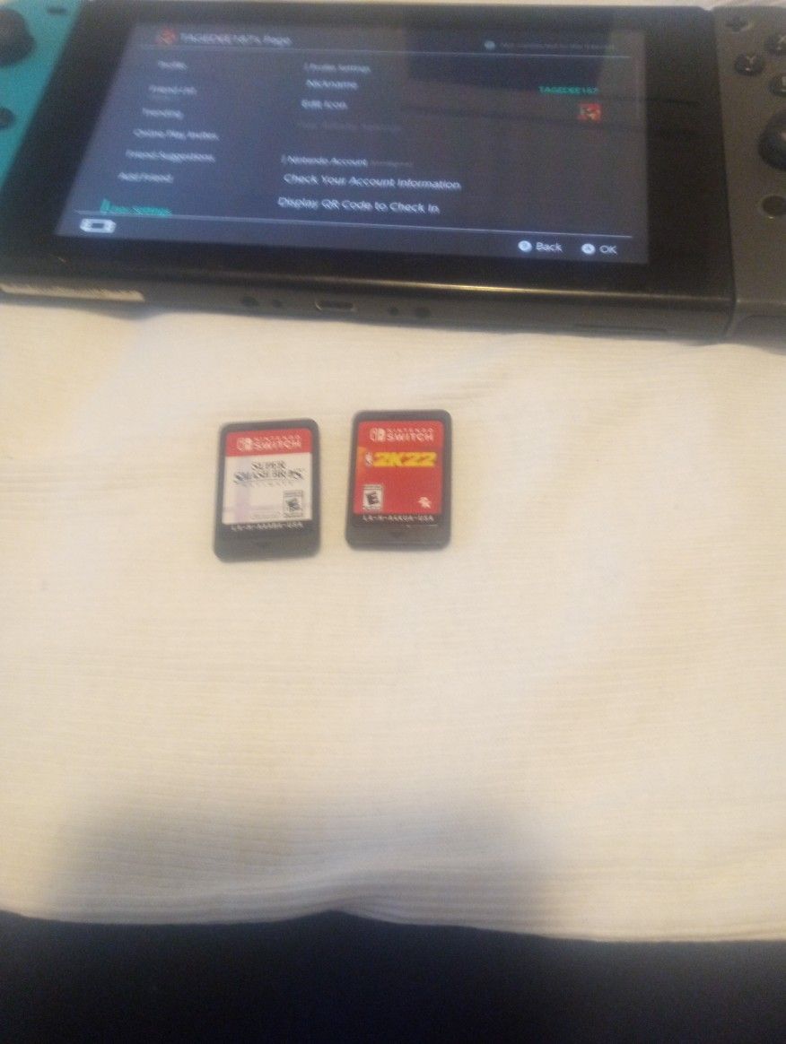 Nintendo Switch And Two Games