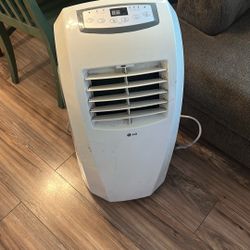 LG 10,000 BTU Portable Air Conditioner - IP1015WNT. Condition is Used.