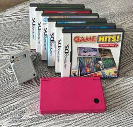 Nintendo DSi in excellent condition with 6 games, complete with charger. $65