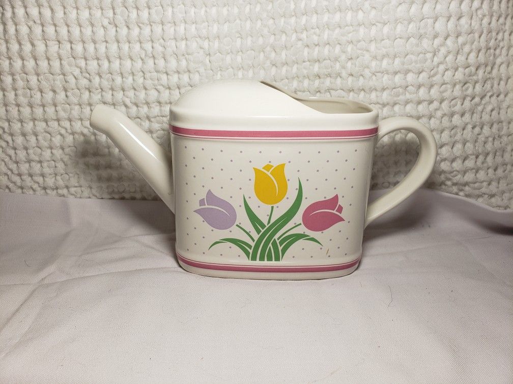 Vintagw 1(contact info removed) Teleflora tulip watering can.  Very good condition  & smoke free home.  Measures 6" T X 11" L X 4 1/4" W .