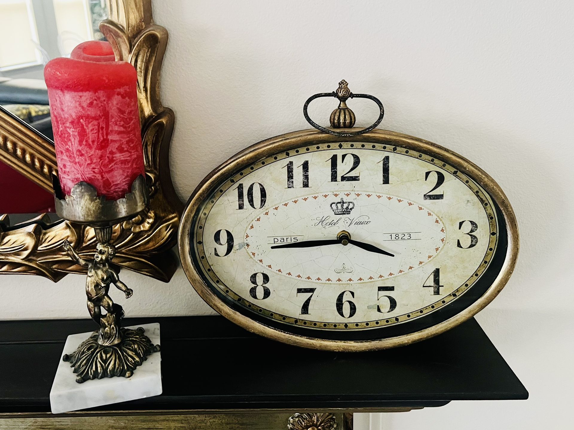 Antique bronze finish French style wall oval clock . 