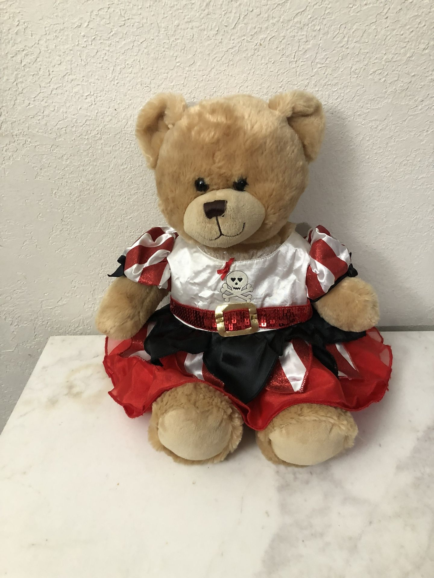 Build A Bear Workshop Teddy Bear Wearing A Really Cute Pirate Dress. The Dress Is New. Size 15 Inches Tall. Preowned excellent condition.