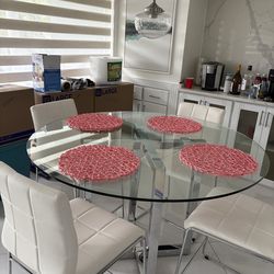 Glass pub height table with four chairs in new condition $695