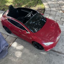 Kids Ride around Tesla 