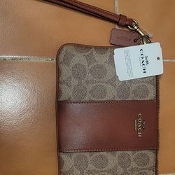 Authentic Coach designer Wristlets. for sale