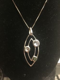 925 Sterling silver necklace with rare stone charm.. 18" inches.. $15