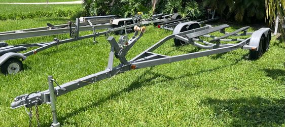 Galvanized dual torsion axel trailer up to 23’ boat or 10,000lb. New winch, all new 14’ tires. All other components are in good condition. Ready to lo
