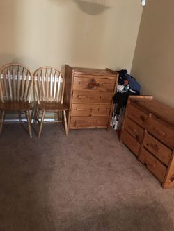 Two wood dressers and three chairs