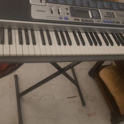 Casio LK-100 61 Silver Lighted Key Electronic Keyboard With Stand