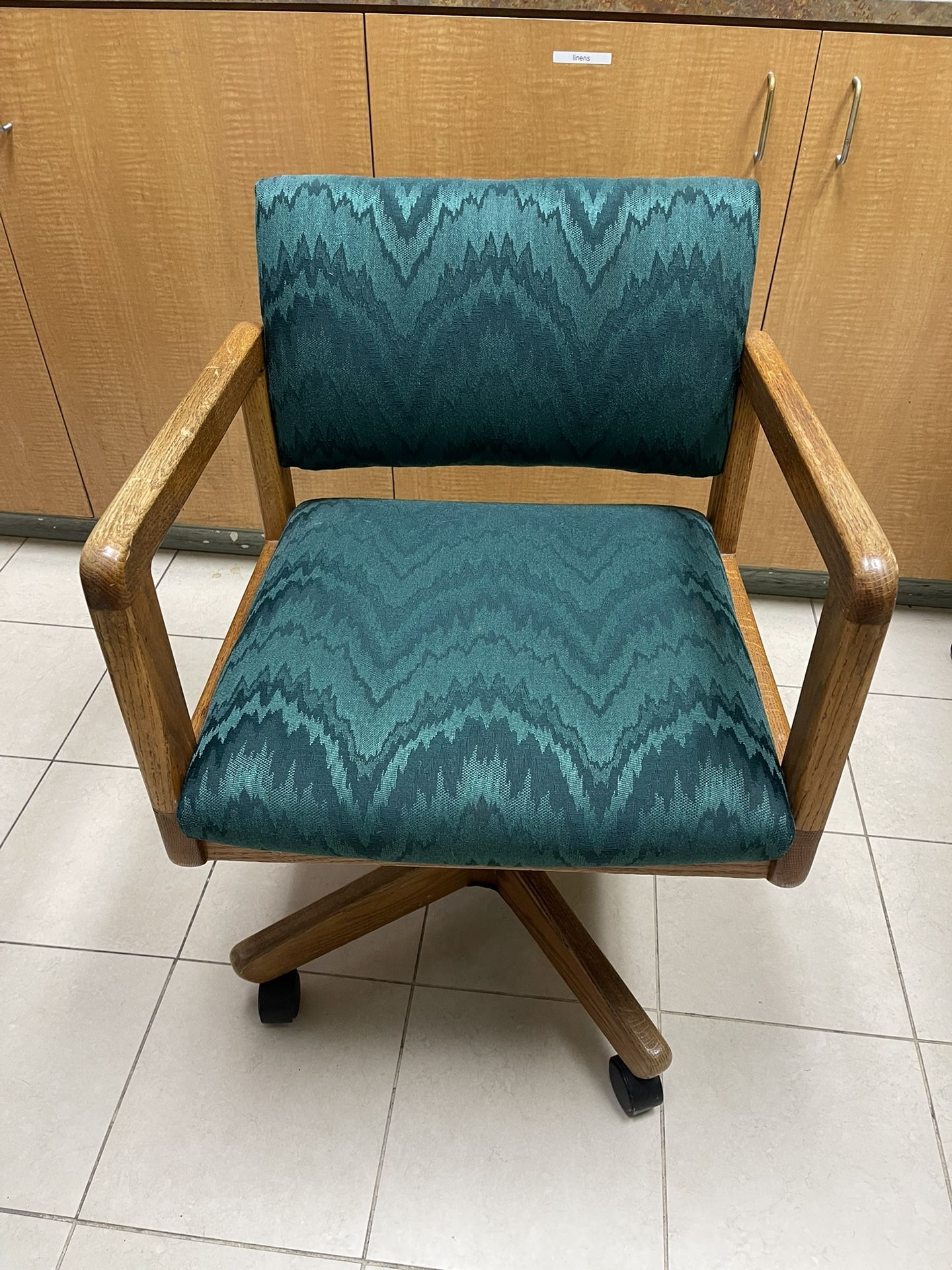 Green Brocade Upholstered Rolling Oak Chair