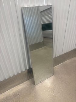 Silver chrome frame full dress back of the door mirror…. 20” x 55” . $50