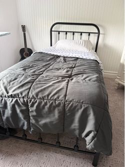 Black bed and mattress