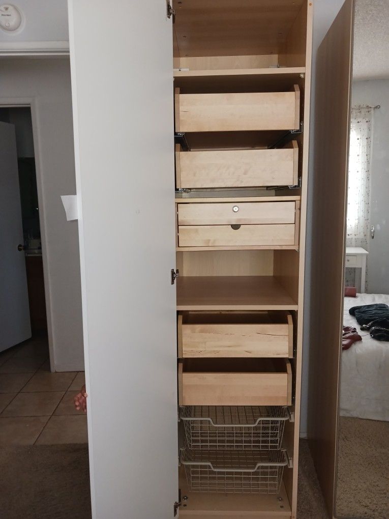 Ikea White Cabinet With Drawers, Shelves, And Basket.